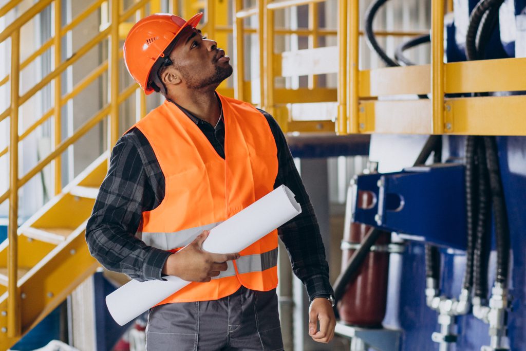 african american worker standing uniform wearing safety hat factory